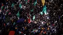 Ribuan orang berkumpul menyambut tibanya para tahanan Palestina. (Kenzo TRIBOUILLARD/AFP