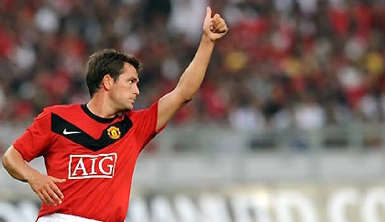 Michael Owen seusai mencetak gol untuk Manchester United yang berhadapan dengan Malaysia di Stadion Bukit Jalil, Kuala Lumpur. 18 Juli 2009. AFP PHOTO/Saeed KHAN