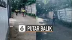 Rombongan pesepeda dan seorang yang jogging itu akhirnya putar balik setelah tak menghiraukan peringatan dari perekam video.