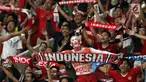 Suporter tim Garuda bersorak merayakan kemenangan Timnas Indonesia atas Timor Leste pada penyisihan grup B Piala AFF 2018 di Stadion GBK, Jakarta, Selasa (13/11). Indonesia unggul 3-1. (Liputan6.com/Helmi Fithriansyah)