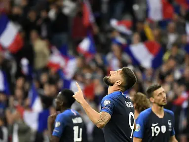 Striker Prancis, Olivier Giroud, merayakan gol yang dicetaknya ke gawang Albania pada laga Kualifikasi Piala Eropa 2020 di Stade de France, Paris, Sabtu (7/9). Prancis menang 4-1 atas Albania. (AFP/Lionel Bonaventure)