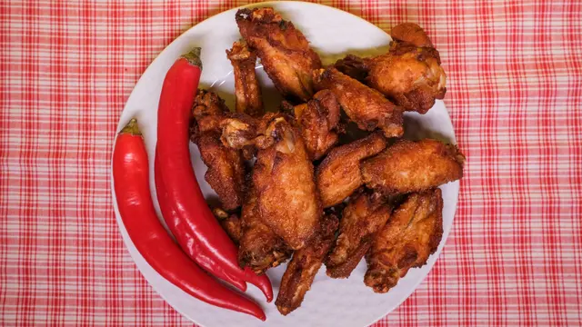 spicy wings (pexels/alena shekhovtcova)