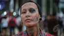 Sejumlah wajah nyentrik bermunculan di acara Indonesia Greaser Party 2015, Plaza Barat Senayan, Jakarta, Minggu (12/4/2015). Body piercing dan tattoo menjadi ciri khas tersendiri. (Liputan6.com/Faizal Fanani)