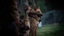 Sejumlah anjing menghadiri sesi pelatihan di sekolah pelatihan anjing polisi Chile di Santiago, 9 Oktober 2018. Dua ratus anjing dari ras yang berbeda mengikuti pelatihan di paru-paru kota Santiago. (Martin BERNETTI/AFP)