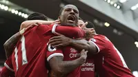 Bintang Liverpool, Georginio Wijnaldum, setelah mencetak gol ke gawang Middlesbrough, dalam pertandingan lanjutan Premier League, di Stadion Anfield, Minggu (21/5/2017). (AFP/Paul Ellis). 