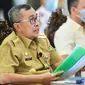 Gubernur Riau Syamsuar dalam rapat penanganan percepatan Covid-19. (Liputan6.com/Istimewa)
