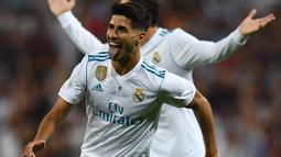 Gelandang Real Madrid, Marco Asensio berada pada peringkat kedua daftar top scorer Los Blancos, Asensio total mencetak tujuh gol di semua leel kompetisi. (AFP/Gabriel Bouys)