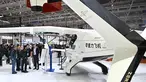 Pengunjung terlihat di samping pesawat Zerog eVTOL model ZG-T6 di stan Zerog selama Aero Asia 2025 di Zhuhai, Provinsi Guangdong, Tiongkok selatan, pada Kamis 27 November 2025. Pameran penerbangan dan kedirgantaraan internasional Aero Asia 2025 resmi dibuka. (Hector RETAMAL/AFP)