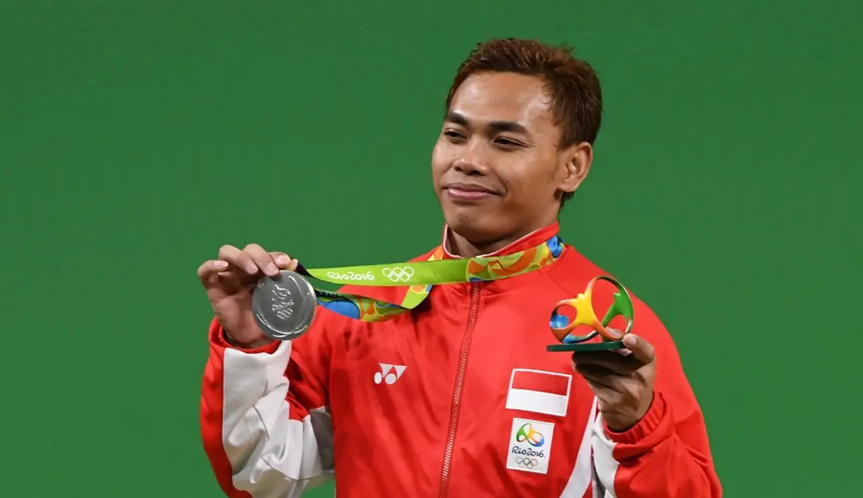 Indonesia meraih medali kedua di ajang Olimpiade Rio de Janeiro 2016 setelah lifter Eko Yuli Irawan menyabet medali perak di cabang angkat besi kelas 62 kg, Selasa (9/8/2016) pagi WIB. (AFP/Goh Chai Hin)