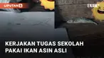 Seorang bocah perempuan dapat tugas menggambar ikan dari sekolah mengundang perhatian