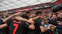 Bayer Leverkusen berhasil mengunci titel juara Bundesliga musim ini setelah sukses membungkam Werder Bremen dengan skor 5-0 pada laga pekan ke-29 di BayArena, Minggu (14/5/2024) malam WIB. (AFP/INA FASSBENDER)