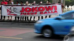 Relawan Jokowi-Jusuf Kalla melakukan aksi simpatik di Bundaran HI Jakarta, (17/10/14). (Liputan6.com/Johan Tallo)