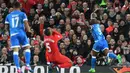 Striker Bournemouth, Benik Afobe, melakukan selebrasi usai mencetak gol ke gawang Liverpool dalam laga lanjutan liga Inggris di Stadion Anfield, Rabu (5/4/2017). Liverpool ditahan imbang dengan skor 2-2. (AFP/ Paul Ellis).