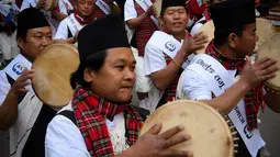 Anggota komunitas adat Gurung mengenakan pakaian tradisional saat mengikuti upacara perayaan Tahun Baru 'Tamu Lhosar' di Kathmandu, Nepal (30/12/2022). Acara itu digelar untuk menyambut pergantian tahun. (AFP/Prakash Mathema)