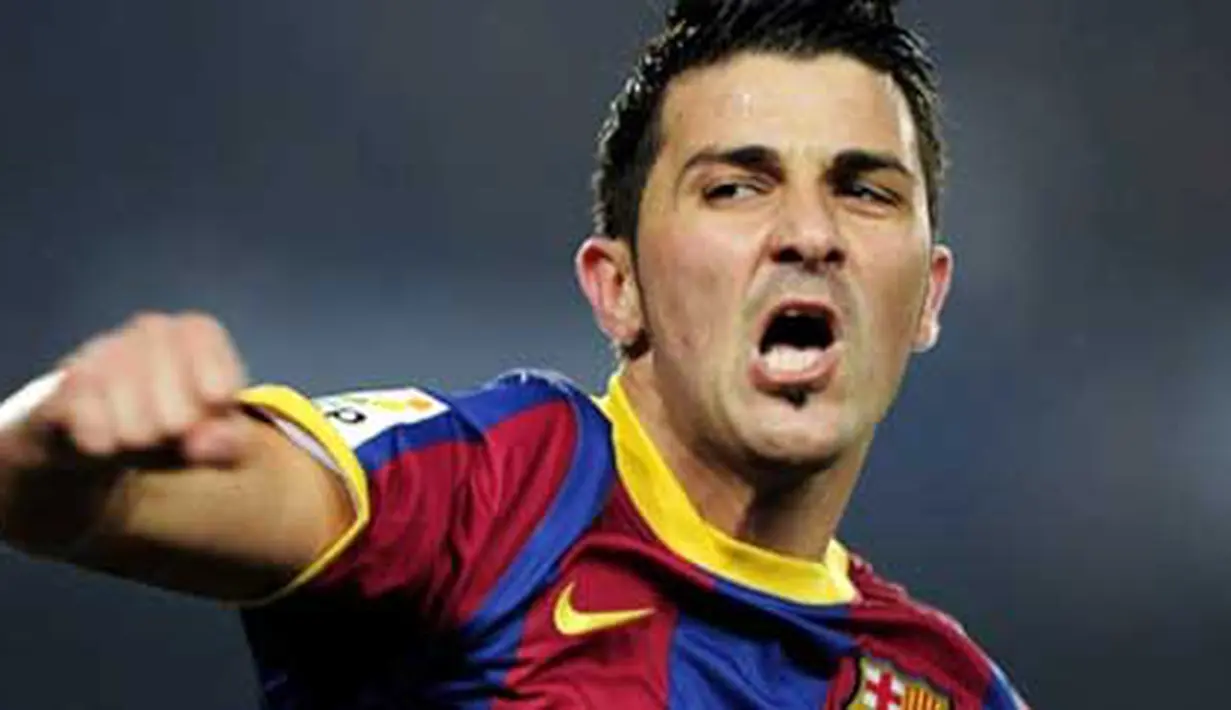 Selebrasi striker Barcelona David Villa seusai menjebol gawang Malaga dalam lanjutan La Liga yang berlangsung di Nou Camp Stadium, 16 Januari 2011. Barca unggul 4-1. AFP PHOTO / JOSEP LAGO 