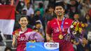 4. Praveen Jordan/Melati Daeva - Pasangan Indonesia ini di luar dugaan berhasil menjuarai All England 2020. Berstatus unggulan kelima, Praveen/Melati membungkam unggulan ketiga asal Thailand, Dechapol Puavaranukroh/Sapsiree Taerattanachai dengan skor 21-15, 17-21, dan 21-8. (AFP/Jung Yeon-Je)