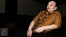 Kasubdit Kasasi Perdata MA Andri Tristianto Sutrisna tersenyum saat menjalani sidang perdana di Pengadilan Tipikor, Jakarta, Kamis (23/6). Ichsan Suaidi adalah terpidana 5 tahun penjara kasus korupsi pembangunan dermaga di NTB. (Liputan6.com/Helmi Afandi)
