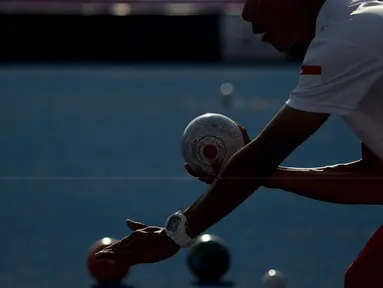 Kacung atlet Lawnball Indonesia bertanding di nomor B2 Open Single's pada Asian Para Games 2018 di Stadion Hockey, Gelora Bung Karno Jakarta, Senin (8/10/2018).  (Bola.com/Peksi Cahyo)