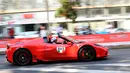Pengendara melaju membawa mobil Ferrari saat perayaan ulang tahun Ferrari ke-70 di Corso Sempione di Milan, Italia (8/9). Dalam acara ini sekitar 500 mobil Ferrari dari berbagai tipe pamerkan. (AFP Photo/Miguel Medina)