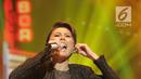 Penyanyi Agnes Monica alias Agnez Mo saat Konser Raya 24 Tahun Indosiar Luar Biasa di JCC Senayan, Jakarta, Jumat (11/1). Agnez Mo membawakan tiga lagu saat tampil bersama Iwan Fals. (Fimela.com/Bambang Eros)