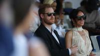 Pangeran Harry dan Meghan&amp;nbsp;Markle&amp;nbsp;menghadiri pertandingan polo amal di Ikoyi Polo Club di Lagos pada 12 Mei 2024 saat mengunjungi Nigeria sebagai bagian dari perayaan ulang tahun ke-10 Invictus Games. (Kola Sulaimon/AFP)
