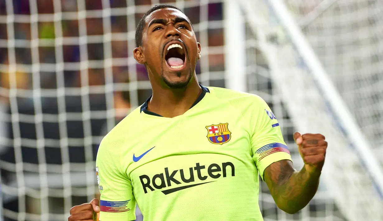 Penyerang Barcelona, Malcom Silva berselebrasi usai mencetak gol ke gawang AS Roma pada pertandingan International Champions Cup (ICC) di AT & T Stadium di Arlington, Texas (31/7). Roma menang telak 4-2 atas Barcelona. (AFP Photo/Cooper Neill)