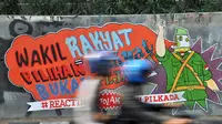 Mural di tembok fly over kawasan Pejompongan tersebut bertuliskan 'Waki Rakyat = Pilihan Rakyat Bukan Pejabat # Reacting Tolak RUU Pilkada' , Jakarta, (28/9/14). (Liputan6.com/Miftahul Hayat) 
