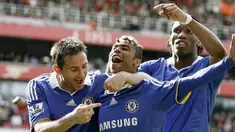 Chelsea's Ashley Cole, Frank Lampard and Didier Drogba celebrates the own goal by Arsenal's Ivory Coast player Kolo Toure during their Premiership football match at The Emirates Stadium on May 10, 2009. AFP PHOTO/IAN KINGTON