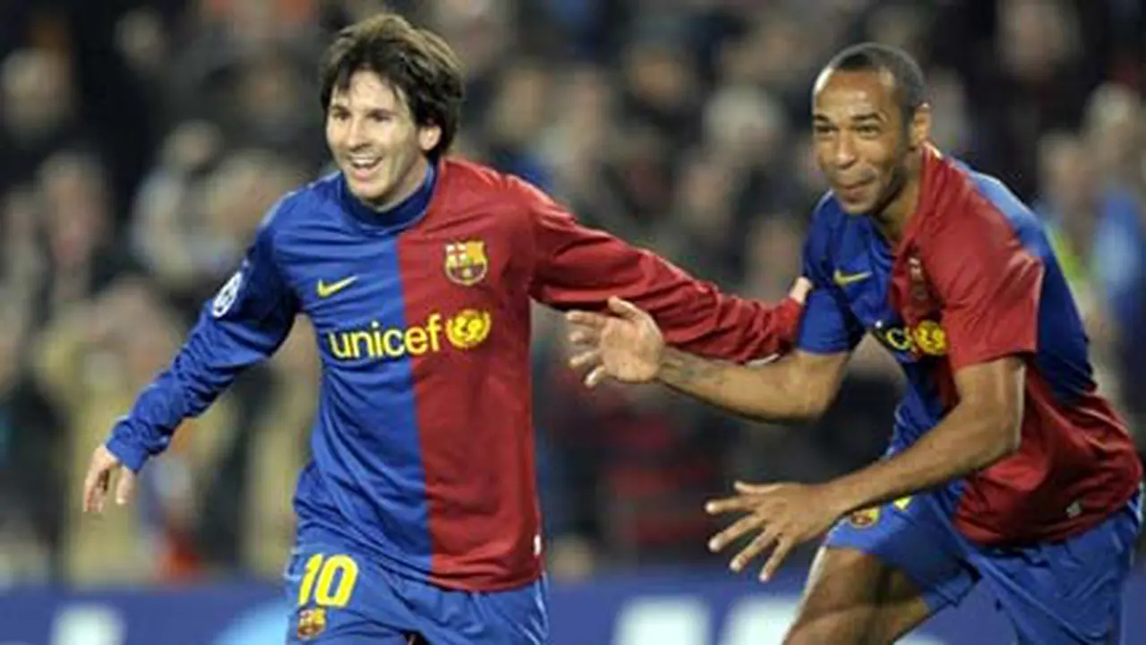 Messi & Henry (© AFP 2009)