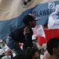 Anak terlihat saat gelaran Capres No 02 Prabowo Subianto menyapa Bogor di area Stadion Pakansari, Kab Bogor, Jumat (29/3). Bawaslu menegaskan selama proses kampanye anak-anak tidak boleh dilibatkan. Larangan tersebut diatur dalam UU No 7 tahun 2017 tentang Pemilu. (Liputan6.com/Helmi Fithriansyah)