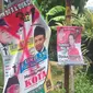 Salah satu alat peraga kampanye caleg yang dirusak. (Liputan6.com/Edhie Prayitno Ige)