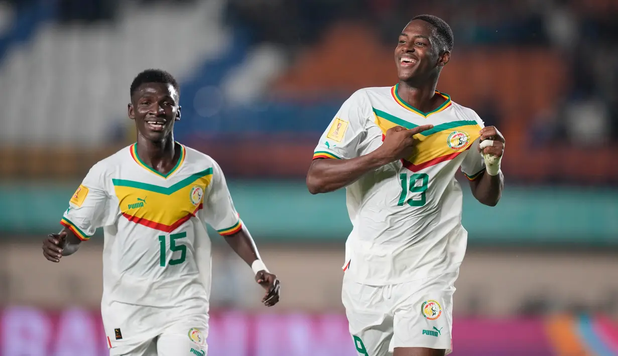 Senegal membuka keunggulan atas Polandia melalui aksi Idrissa Gueye yang memanfaatkan umpan Yaya Dieme. (AP Photo/Achmad Ibrahim)