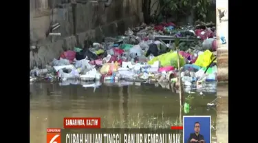 Curah hujan yang tinggi ditambah pasang air laut diduga menjadi penyebab banjir tak kunjung surut.