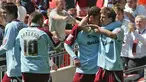 Wade Elliot of Burnley congratulated by teammates after he scored during the Championship Play-Off Final between Burnley and Sheffield United at Wembley Stadium, Monday 25 May 2009. AFP PHOTO/Geoff CADDICK