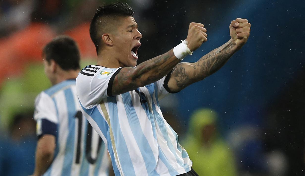 Marcos Rojo. Bek berusia 30 tahun ini tampil cemerlang bersama Timnas Argentina di Piala Dunia 2014 Brasil. Melaju hingga final dan kalah 0-1 dari Jerman melalui babak extra time, ia tampil dalam 6 laga, termasuk partai final dengan torehan 1 gol dan 1 assist. (AFP/Adrian Dennis)