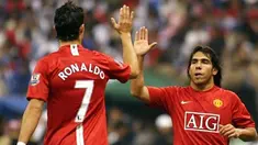 Manchester United's Cristiano Ronaldo (L) celebrates with teammate Carlos Tevez after scoring the second goal against al-Hilal during their football match at King Fahd Stadium in Riyadh, 21 January 2008. Hilal won the match 3-2. AFP PHOTO/HASSAN AMMA