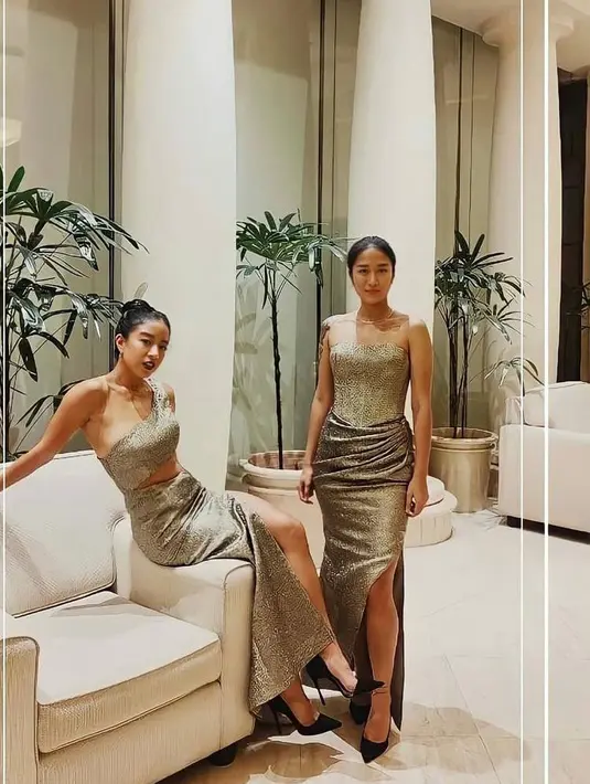 Sang kakak mengenakan gaun model one shoulder, rambutnya ditata hair bun dengan aksesori berupa anting-anting dan kalung tipis (Instagram/queeninfinity94)