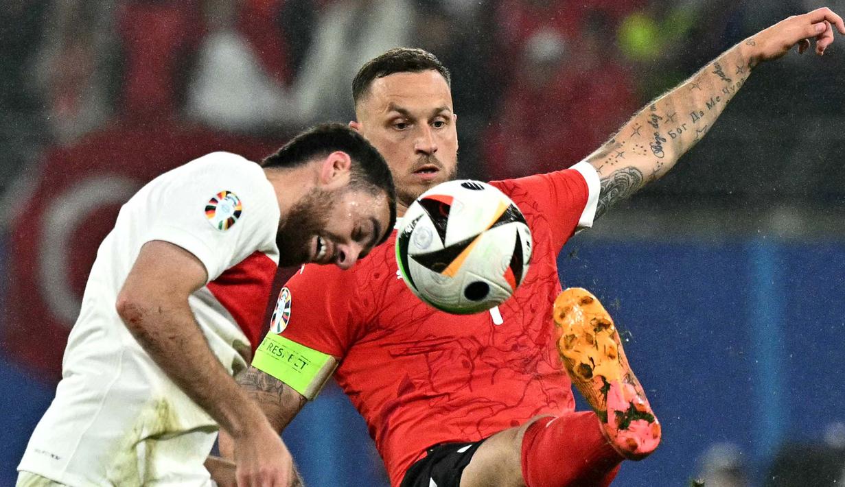 Hingga babak kedua usai, skor tidak berubah 2-1 untuk kemenangan Turki atas Austria. (JAVIER SORIANO/AFP)