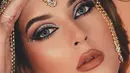 <p>Tampilan avant-garde Tasya Farasya kali ini bisa dilihat dari makeup looknya. Detail makeup look yang bold ini luar biasa, karena Tasya Farasya berhasil menonjolkan semua area wajahnya dengan baik lewat teknik dan palet warna yang dipilihnya. Ia juga menambahkan head-piece yang sesuai dengan karakter yang ingin dihadirkannya. Foto: Instagram.</p>