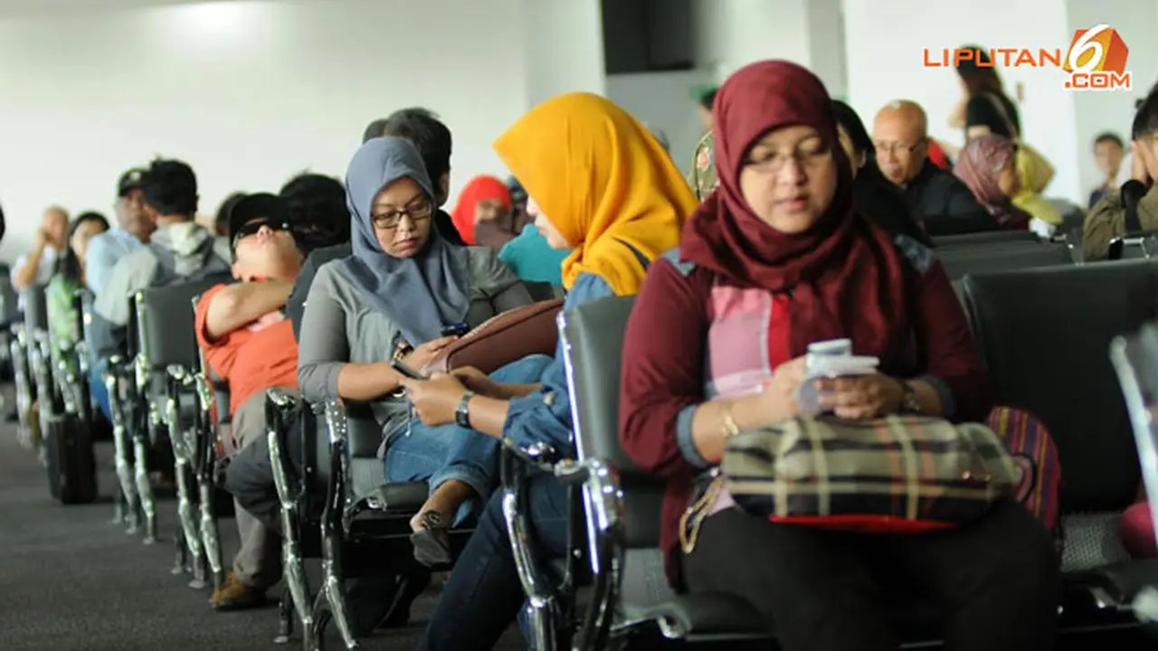 penumpang-bandara-140123c.jpg