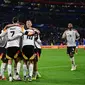 Pemain Timnas Jerman merayakan gol yang tercipta ke gawang Prancis dalam pertandingan uji coba internasional di Groupama Stadium, Minggu (24/3/2024) dini hari WIB. Jerman menang 2-0 atas Prancis dalam laga tersebut. (Olivier CHASSIGNOLE / AFP)