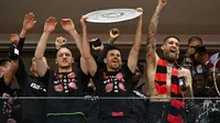 Bayer Leverkusen berhasil mengunci titel juara Bundesliga musim ini setelah sukses membungkam Werder Bremen dengan skor 5-0 pada laga pekan ke-29 di BayArena, Minggu (14/5/2024) malam WIB. (AFP/INA FASSBENDER)