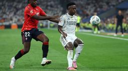 Dikutip ESPN, Vinicius melalui dua agennya Fred Pena dan Thassilo Soares kembali mengajukan nilai kontrak baru dengan Real Madrid, tetapi tawaran tersebut berakhir nihil. (AFP/Thomas Coex)