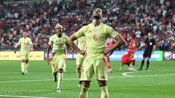 Pemain Spanyol, Mikel Merino, melakukan selebrasi setelah mencetak gol ke gawang Turki di laga kedua Grup E Kualifikasi Piala Dunia 2026 Zona Eropa di Torku Arena, Senin (08/09/2025). (AFP/Ozan Kose)