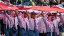 Mereka antusias mengikuti kegiatan yang menjadi rangkaian kemeriahan peringatan HUT ke-80 Republik Indonesia. (Juni KRISWANTO/AFP)