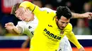 <p>Pemain Real Madrid Toni Kroos (belakang) mencoba untuk menjegal pemain Villarreal Dani Parejo pada pertandingan sepak bola babak 16 besar Copa del Rey di Stadion La Ceramica, Villarreal, Spanyol, 19 Januari 2023. Real Madrid mengalahkan Villarreal dengan skor 3-2. (AP Photo/Jose Breton)</p>
