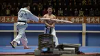 Seorang peserta saat dipukul dengan kayu selama demonstrasi taekwondo sebagai bagian dari Kejuaraan Seni Bela Diri Nasional tahunan Mangyongdae di 'Taekwon-Do Hall' di Pyongyang, Korea Utara (9/11). (AFP Photo/Kim Won Jin)