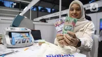 Untuk mendapatkan kuota penukaran uang rupiah baru, masyarakat harus mendaftar terlebih dahulu di aplikasi PINTAR BI. (Liputan6.com/Angga Yuniar)