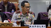 Kapolri Jenderal Pol Tito Karnavian mengikuti rapat kerja dengan Komisi III DPR di Kompleks Parlemen Senayan, Jakarta, Rabu (14/3). Polri juga akan bersinergi dengan aparat penegak hukum lainnya dalam pemberantasan korupsi. (Liputan6.com/Johan Tallo)