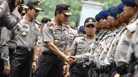 Kapolri Jenderal Pol Sutarman saat mengahadiri apel pengamanan pelantikan presiden dan wakil presiden di halaman Monumen Nasional, Jakarta, Jumat (17/10/2014) (Liputan6.com/Faizal Fanani)